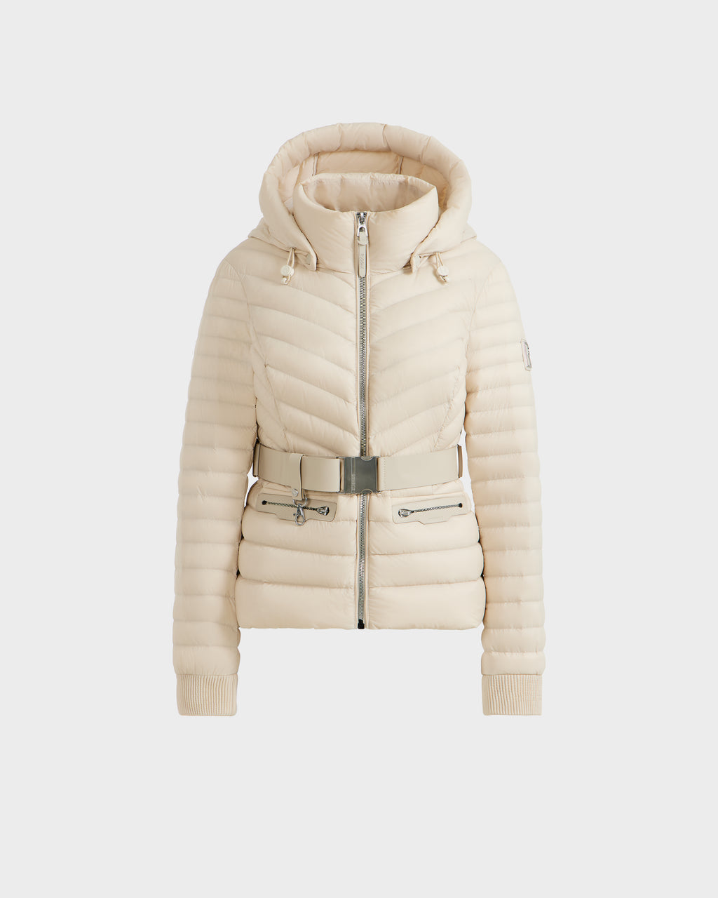 The Rudsak SCARLETT - 8125004 Vanilla is a women’s cream-colored, quilted lightweight down jacket with a hood, zip front, ribbed cuffs, and a vegan leather waist belt with silver buckle, shown on a plain white background.