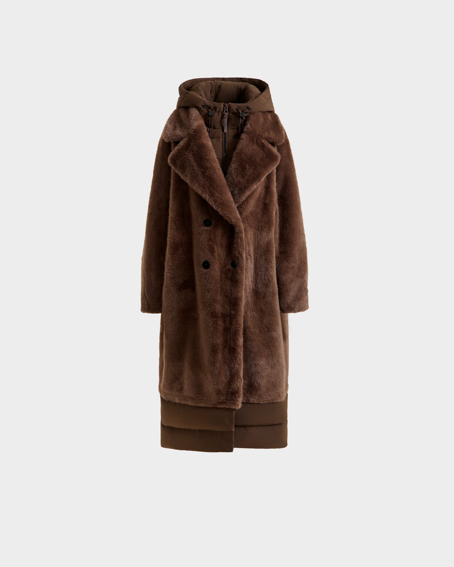 The SIENA - 8125542 Mocha by Rudsak is a long brown women’s faux fur coat with a wide collar, double-breasted front, integrated hood, and a puffer-style hem for a chic and warm winter look.