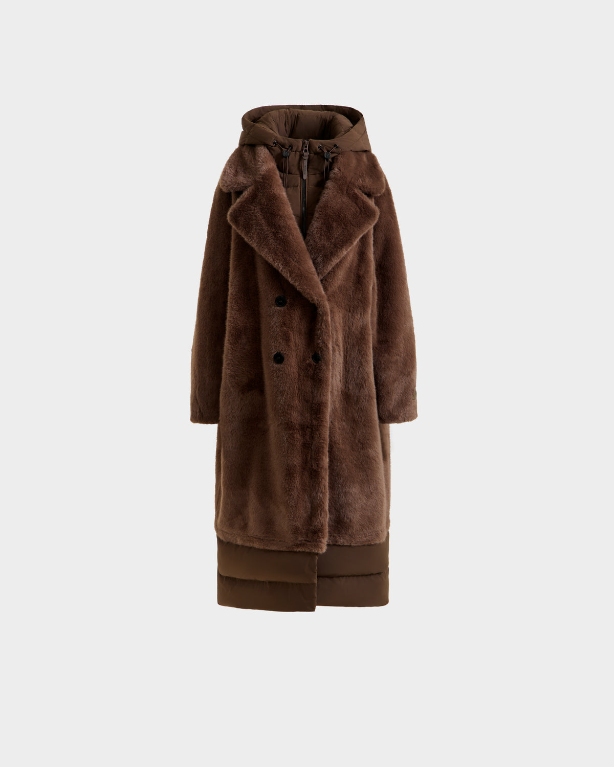 The SIENA - 8125542 Mocha by Rudsak is a long brown women’s faux fur coat with a wide collar, double-breasted front, integrated hood, and a puffer-style hem for a chic and warm winter look.