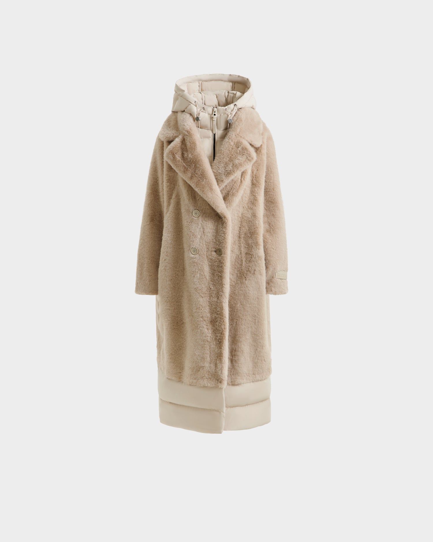 The Rudsak SIENA - 8125542 Vanilla is a long beige women’s faux fur coat featuring a notched collar, double-breasted front, and quilted hooded inner layer—stylish warmth for winter, shown on a plain white background.