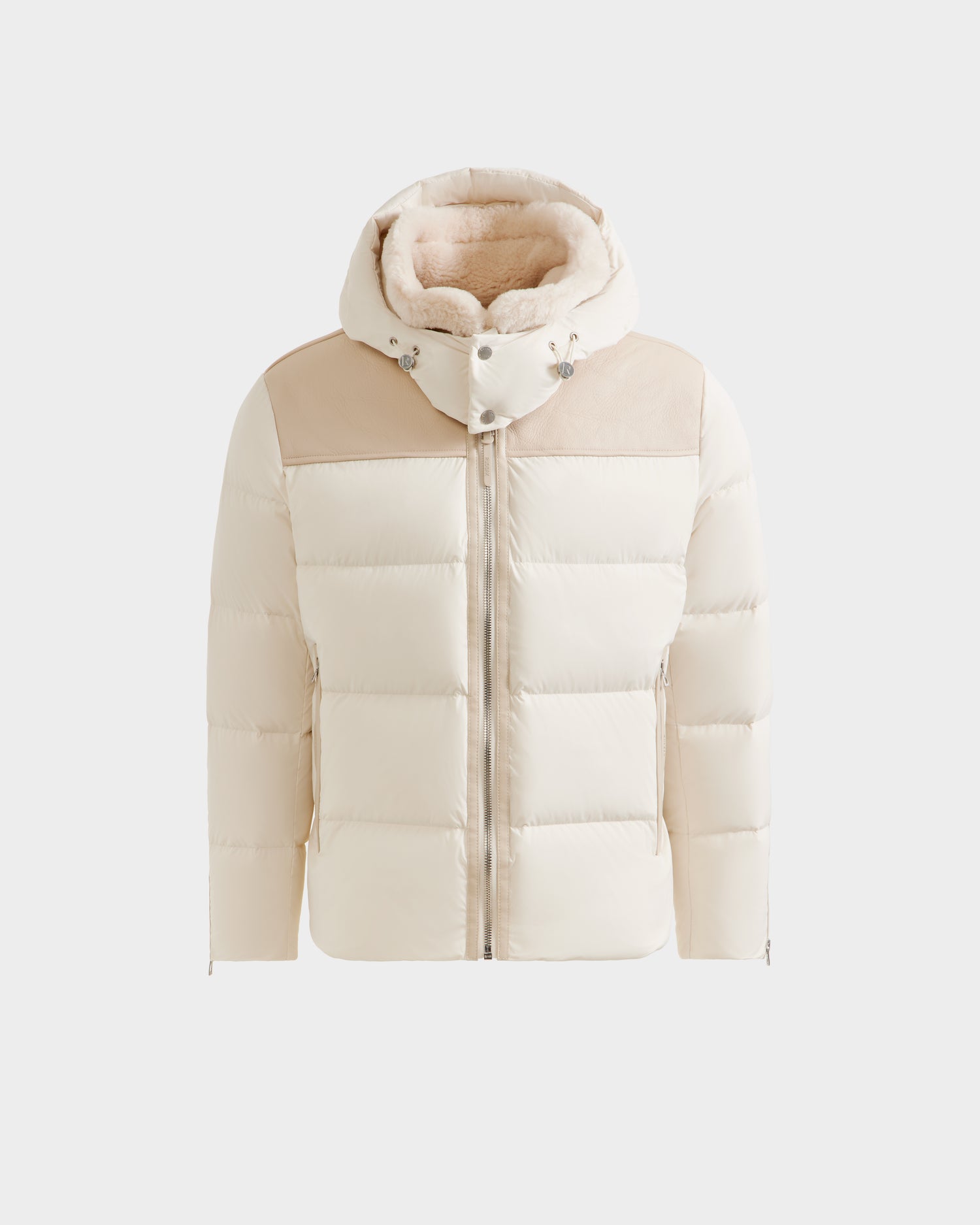 The SIMON - 6125597 Vanilla by Rudsak is a men's cream-colored quilted down puffer jacket with a hood, light tan shoulder panels, plush fleece-lined interior, and front zipper—designed for warmth in cold weather.