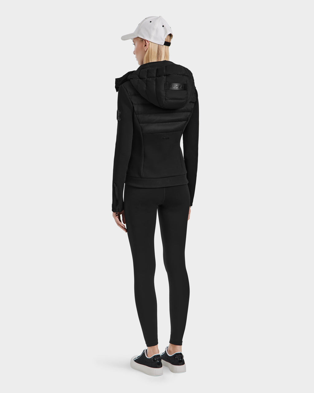 A person wearing the Rudsak MABS - 8124825 Black womens jacket stands facing away, highlighting the back of the jacket against a plain light background.