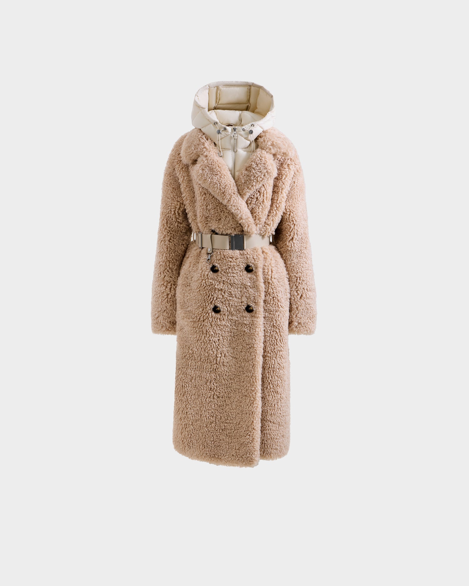 The Rudsak TINA - 8125968 Vanilla is a long beige women's faux fur coat with a wide collar, double-breasted buttons, matching belt, and removable contrasting light hooded bib and liner, shown on a white background.