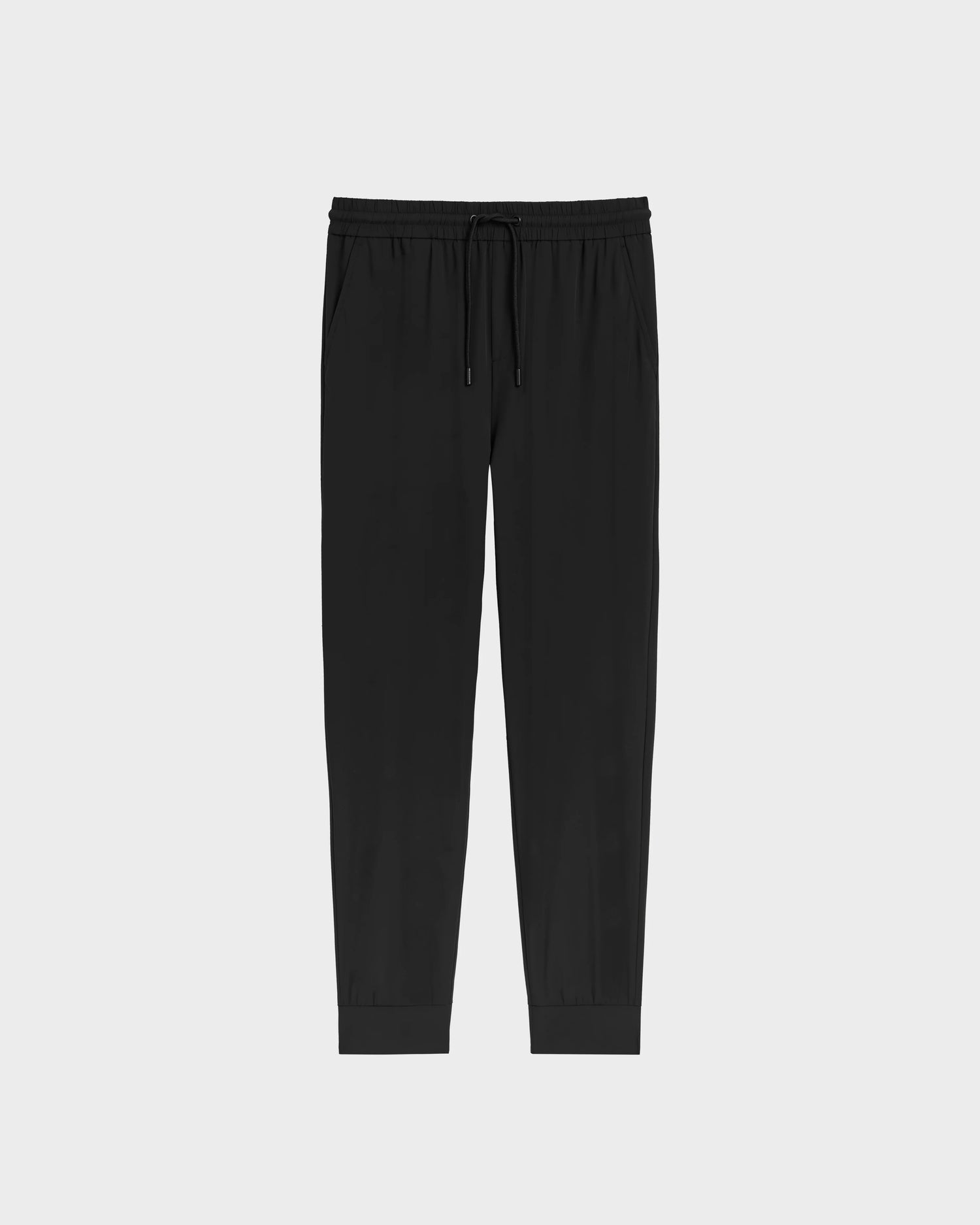 The TUSTIN - 6525029 Black jogger pants by Rudsak feature technical fabric, an elastic waistband, side pockets, and cuffed ankles, shown on a plain light gray background—ideal for mens casual wear.