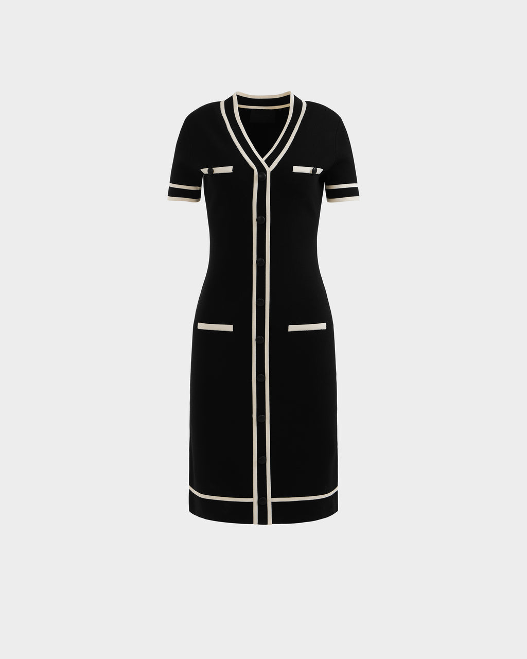 The VINNIE - 8526038 Black by Rudsak is a knee-length, short-sleeved black knit midi dress with white trim, V-neckline, front buttons, and four white-edged pockets—two chest and two hip—shown on a plain white background.