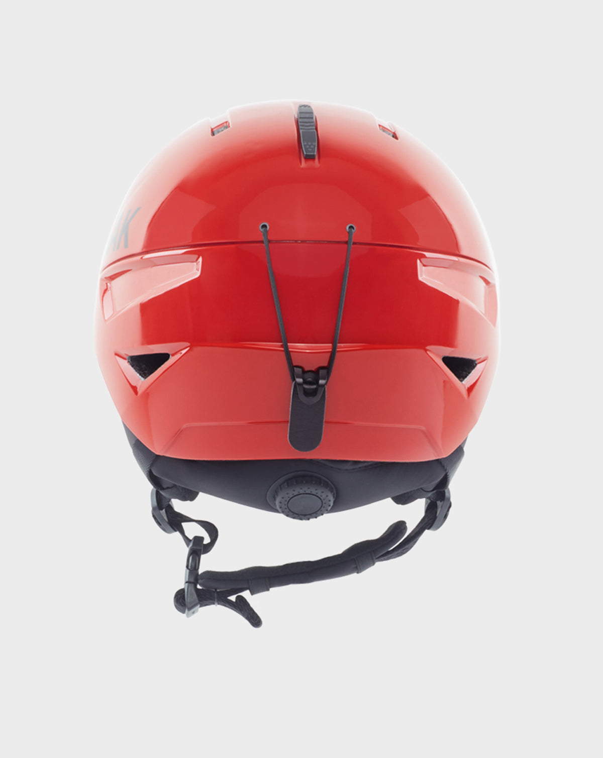 The Rudsak RACE - 9421514 POPPY RED ski helmet, seen from the back, showcases black adjustable straps, a size-adjustment dial, and a black rear elastic cord—part of the Ski Capsule Collection.